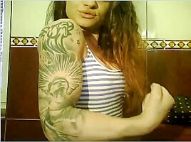 Wild Angel kisses her muscles