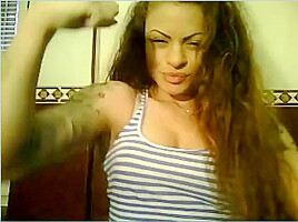 Wild Angel kisses her muscles
