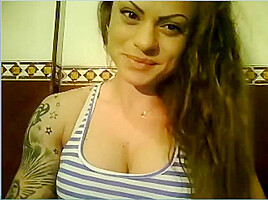 Wild Angel kisses her muscles