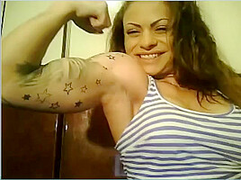 Wild Angel kisses her muscles