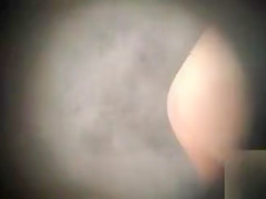 Woman gets spied on while taking a quick shower