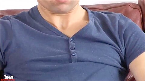 Young pup strokes his uncut cock