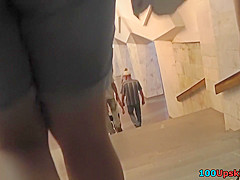 Yummy ass of a brunette seen in real upskirt movie