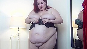 big booty Eliza squeezes her curves into a corset