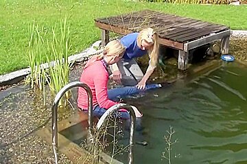 german wetlook with fully clothes swimming