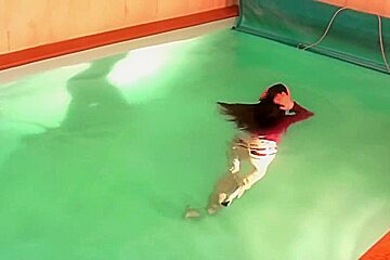 german wetlook with fully clothes swimming