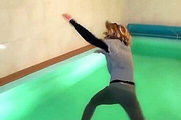 german wetlook with fully clothes swimming