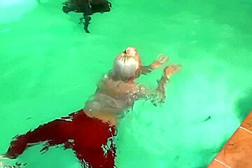 german wetlook with fully clothes swimming