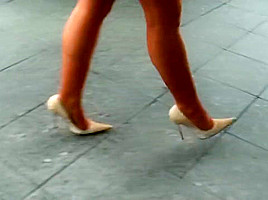 lagy walking in high heels smoking with long nails