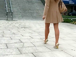 lagy walking in high heels smoking with long nails