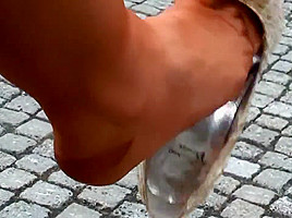 lagy walking in high heels smoking with long nails