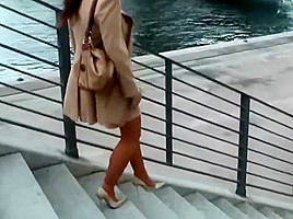 lagy walking in high heels smoking with long nails