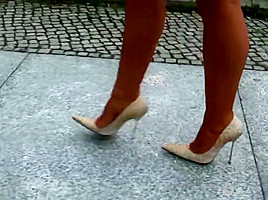 lagy walking in high heels smoking with long nails