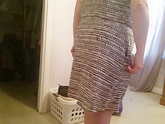 putting on her girdle, under garment over her big tits,