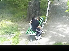 teen 18+ couple making out in public park bench