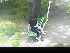 teen 18+ couple making out in public park bench