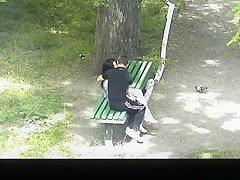 teen 18+ couple making out in public park bench