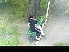 teen 18+ couple making out in public park bench