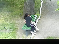 teen 18+ couple making out in public park bench