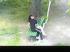 teen 18+ couple making out in public park bench