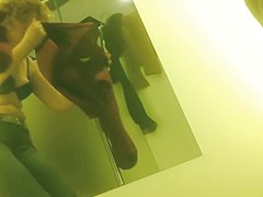 woman in dressing room spied in the bra
